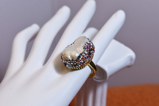 Luxurious and shiny natural Baroque pearl ring with three-dimensional dense inlay of tourmaline and colored zircon. Adjustable ring at the opening