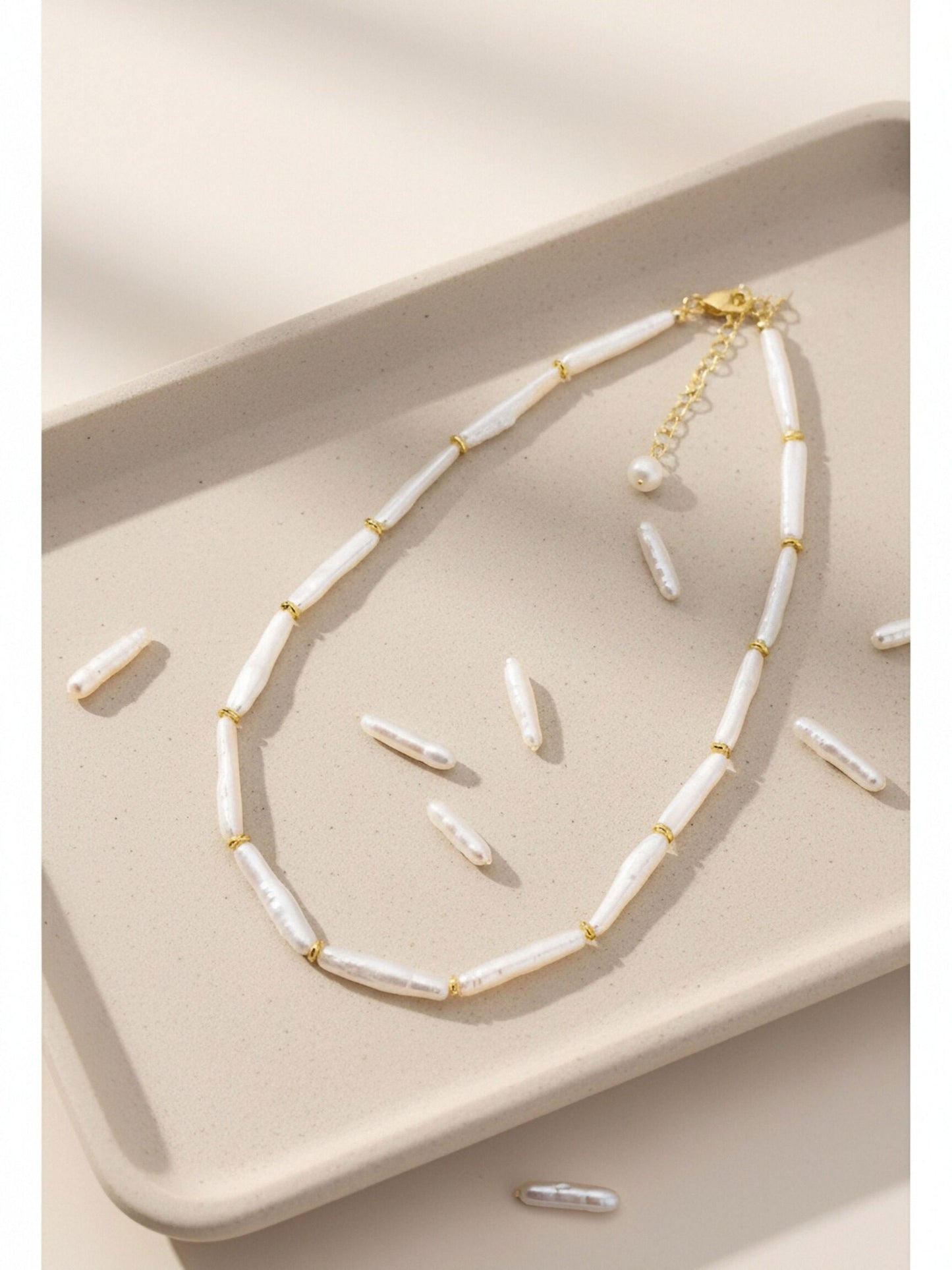 Natural pearl necklace with small silver bar shaped pearl strap and adjustable chain length