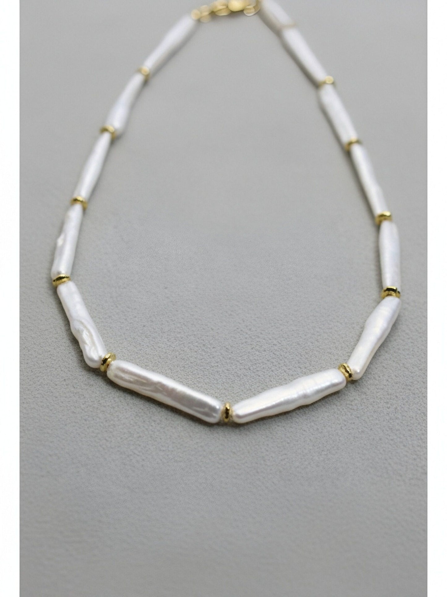 Natural pearl necklace with small silver bar shaped pearl strap and adjustable chain length