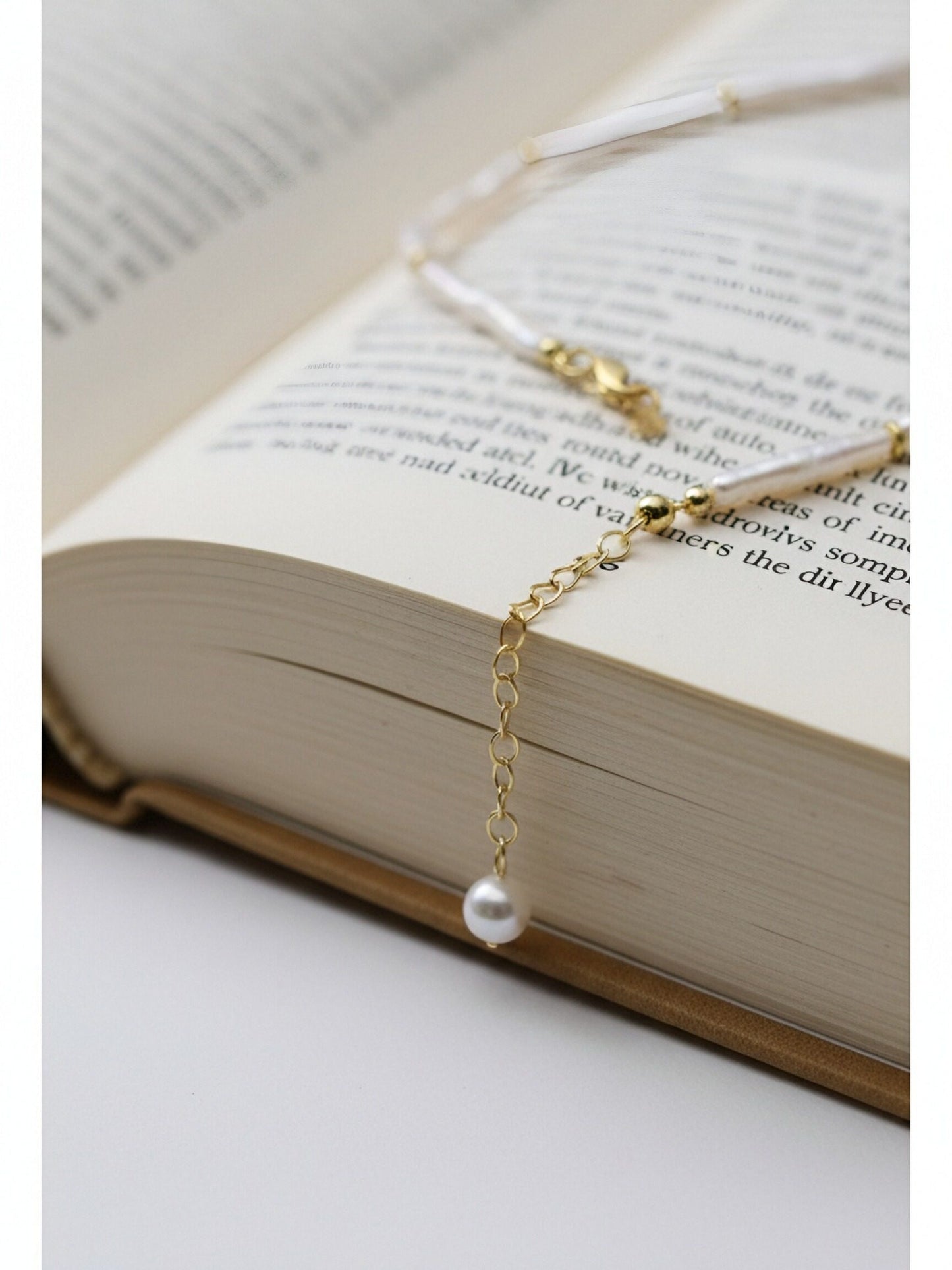 Natural pearl necklace with small silver bar shaped pearl strap and adjustable chain length