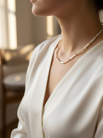 Natural pearl necklace with small silver bar shaped pearl strap and adjustable chain length