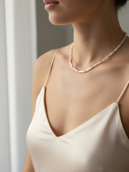 Natural pearl necklace with small silver bar shaped pearl strap and adjustable chain length