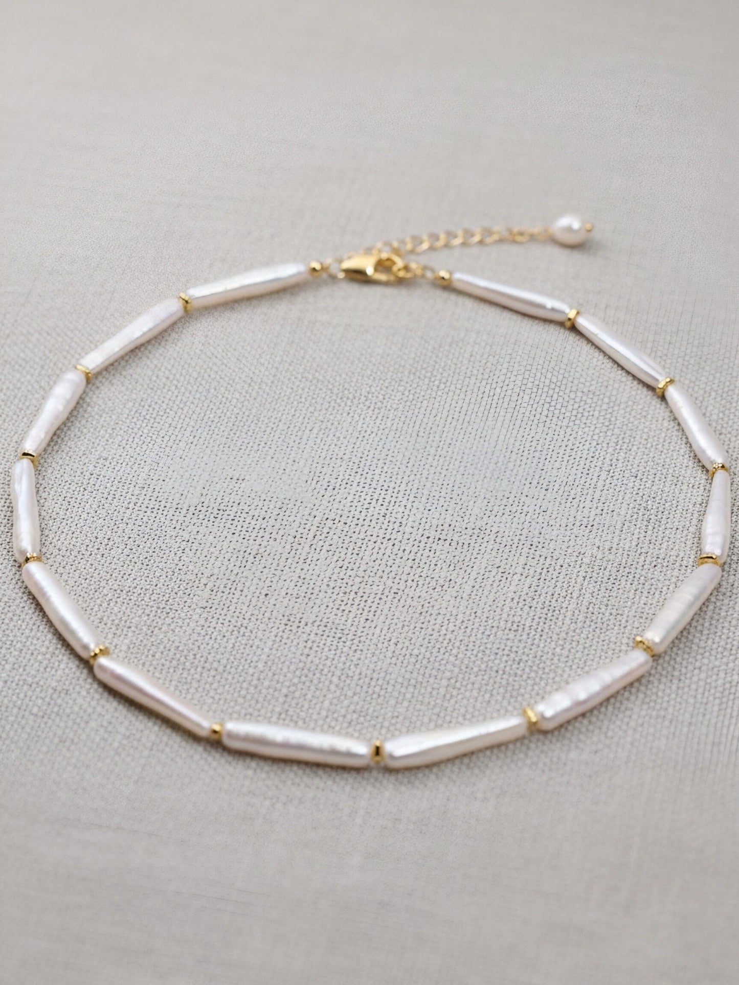 Natural pearl necklace with small silver bar shaped pearl strap and adjustable chain length