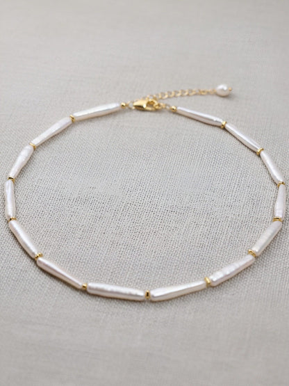 Natural pearl necklace with small silver bar shaped pearl strap and adjustable chain length