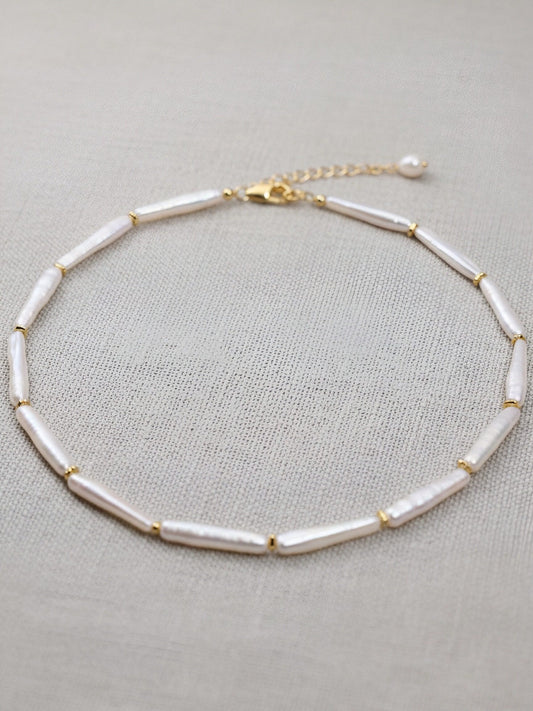Natural pearl necklace with small silver bar shaped pearl strap and adjustable chain length