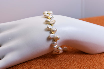 Natural pearl bracelet three piece set paired with smile bracelet and gold open hammer bracelet