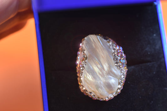 Luxurious and shiny natural Baroque pearl ring with three-dimensional dense inlay of tourmaline and colored zircon. Adjustable ring at the opening