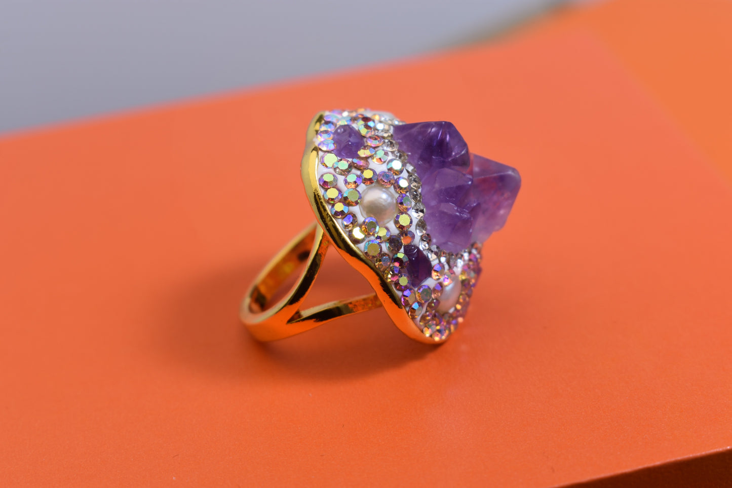 Luxurious and shiny natural amethyst pearl ring with three-dimensional dense inlay of tourmaline and colored zircon. Adjustable ring at the opening