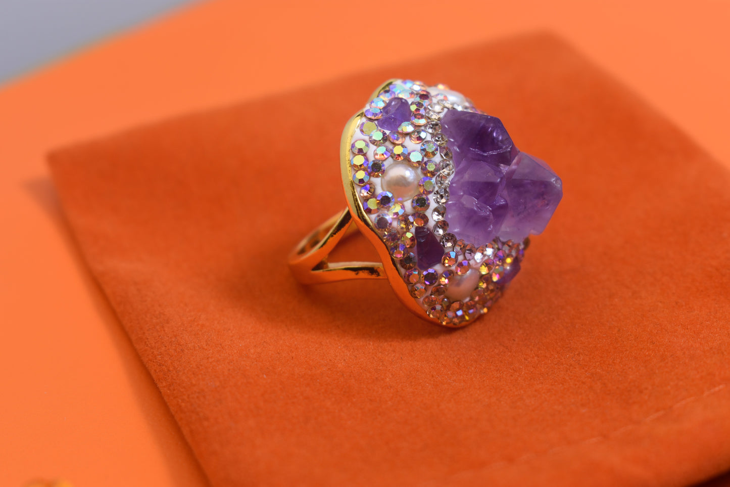 Luxurious and shiny natural amethyst pearl ring with three-dimensional dense inlay of tourmaline and colored zircon. Adjustable ring at the opening