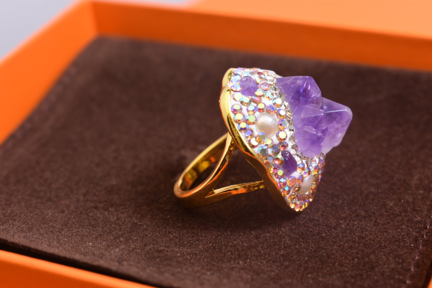 Luxurious and shiny natural amethyst pearl ring with three-dimensional dense inlay of tourmaline and colored zircon. Adjustable ring at the opening