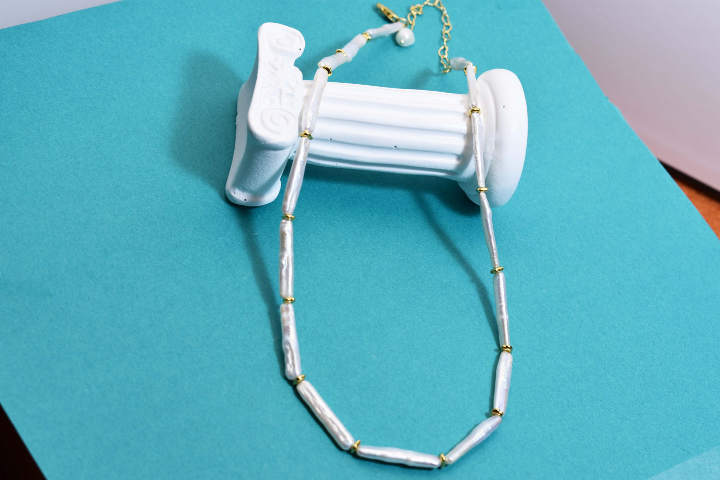 Natural pearl necklace with small silver bar shaped pearl strap and adjustable chain length