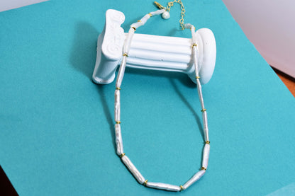 Natural pearl necklace with small silver bar shaped pearl strap and adjustable chain length