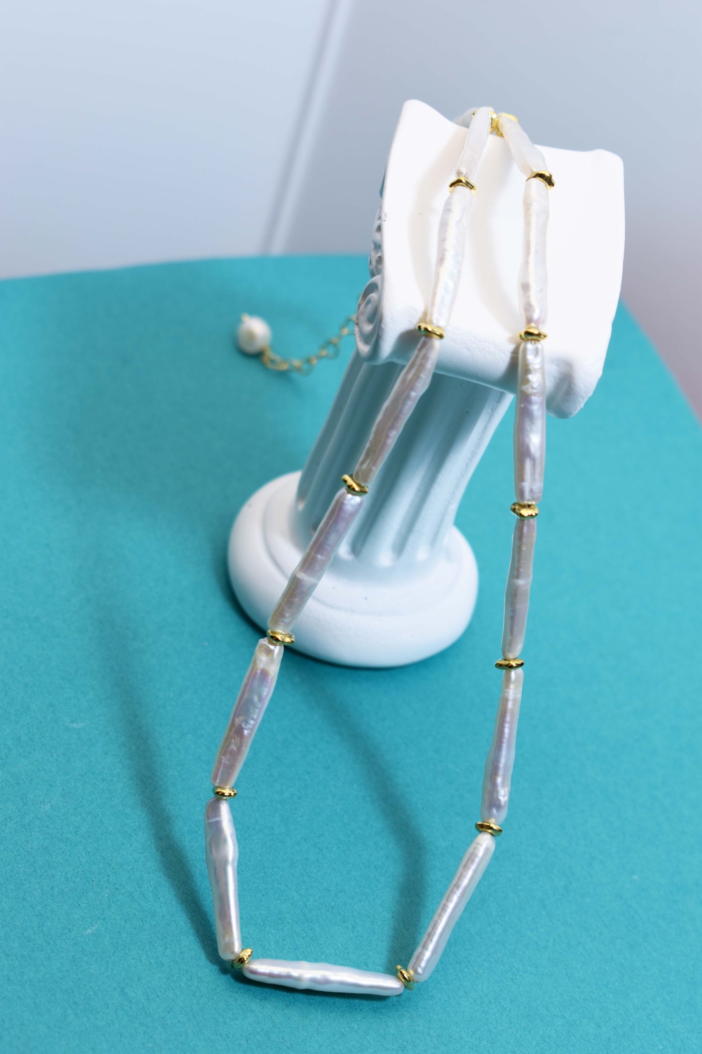 Natural pearl necklace with small silver bar shaped pearl strap and adjustable chain length