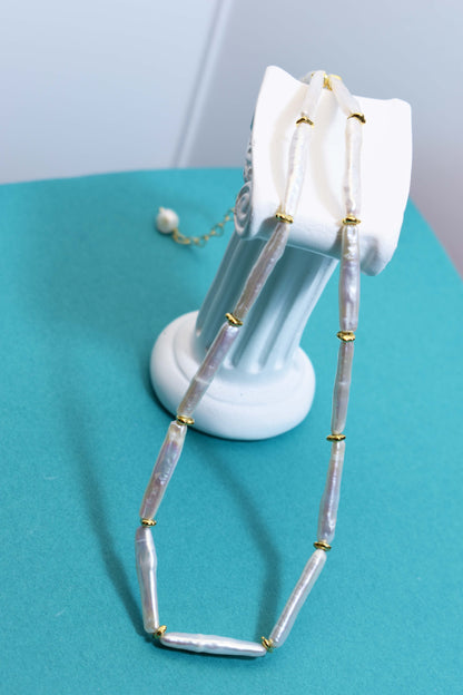 Natural pearl necklace with small silver bar shaped pearl strap and adjustable chain length