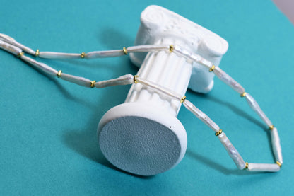 Natural pearl necklace with small silver bar shaped pearl strap and adjustable chain length