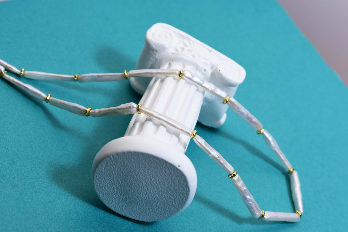 Natural pearl necklace with small silver bar shaped pearl strap and adjustable chain length