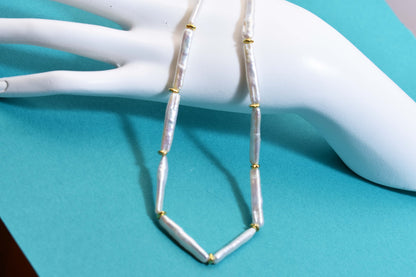 Natural pearl necklace with small silver bar shaped pearl strap and adjustable chain length