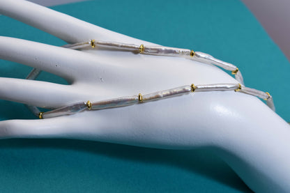 Natural pearl necklace with small silver bar shaped pearl strap and adjustable chain length