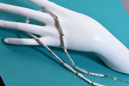 Natural pearl necklace with small silver bar shaped pearl strap and adjustable chain length