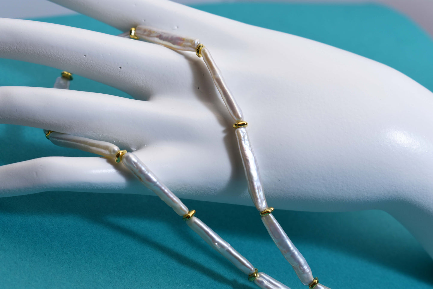 Natural pearl necklace with small silver bar shaped pearl strap and adjustable chain length