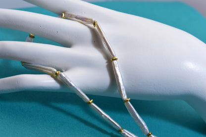 Natural pearl necklace with small silver bar shaped pearl strap and adjustable chain length