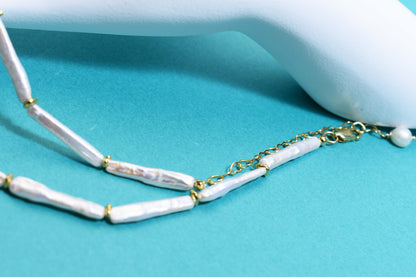 Natural pearl necklace with small silver bar shaped pearl strap and adjustable chain length