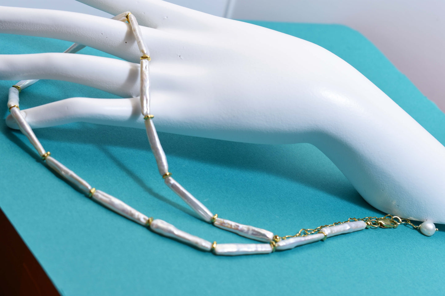 Natural pearl necklace with small silver bar shaped pearl strap and adjustable chain length