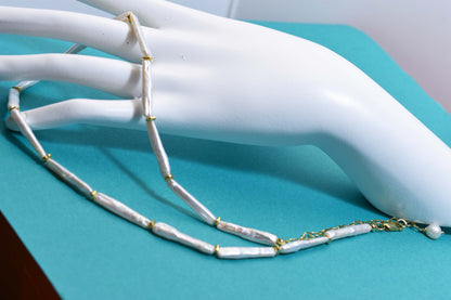 Natural pearl necklace with small silver bar shaped pearl strap and adjustable chain length