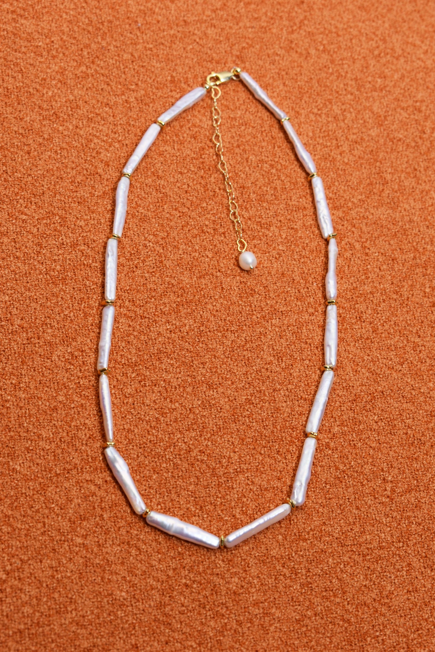 Natural pearl necklace with small silver bar shaped pearl strap and adjustable chain length