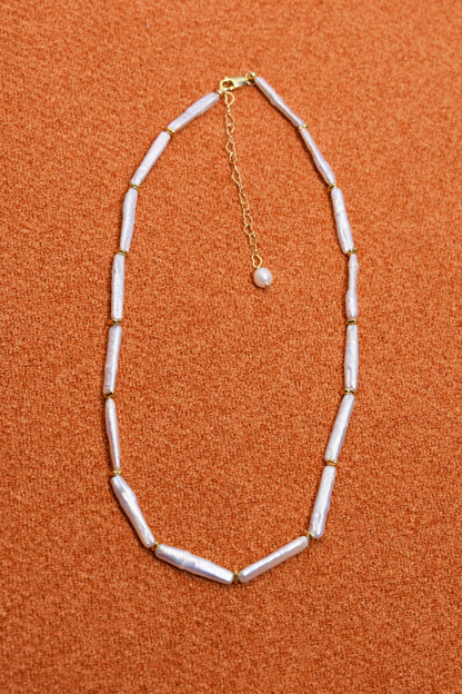 Natural pearl necklace with small silver bar shaped pearl strap and adjustable chain length