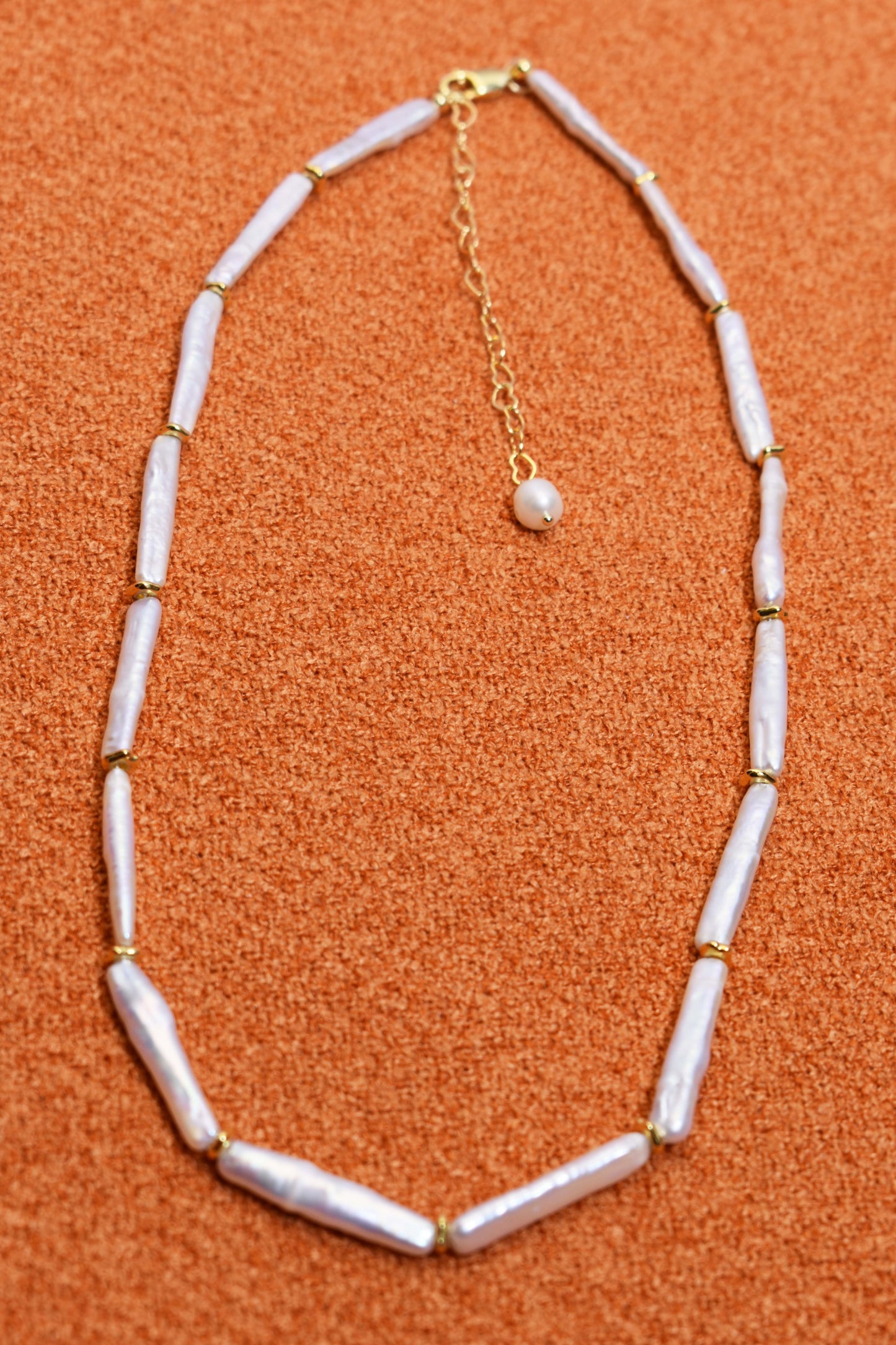 Natural pearl necklace with small silver bar shaped pearl strap and adjustable chain length