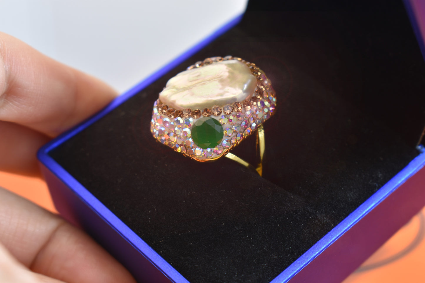 Luxurious shiny natural pearl ring with three-dimensional dense inlay of colored zircon gemstones, adjustable ring at the opening