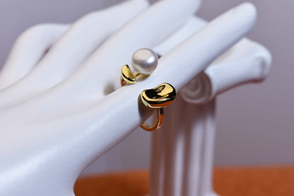 Natural pearl ring with gold size and double petal design with adjustable opening