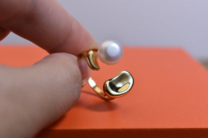 Natural pearl ring with gold size and double petal design with adjustable opening