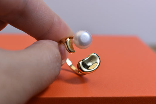 Natural pearl ring with gold size and double petal design with adjustable opening