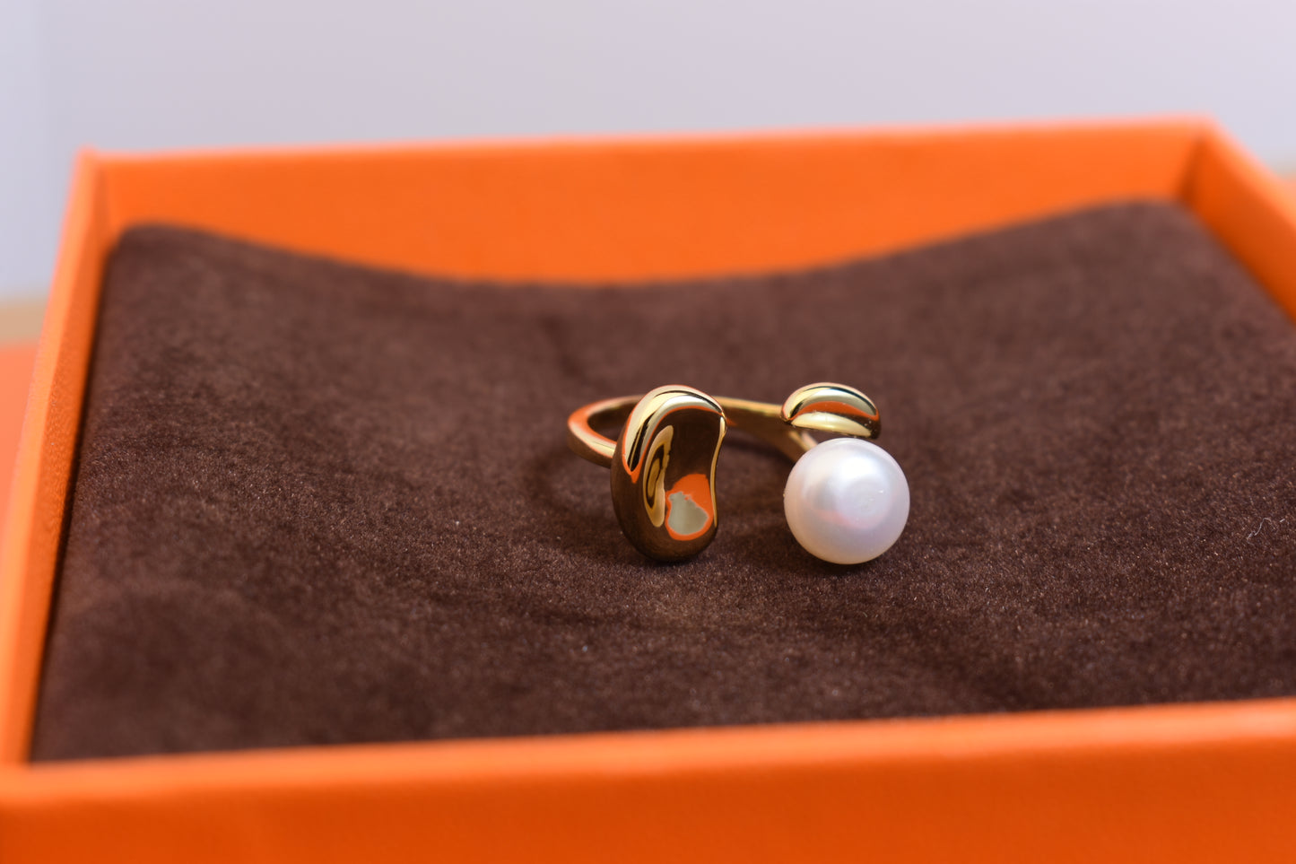Natural pearl ring with gold size and double petal design with adjustable opening